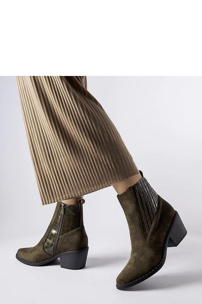 Solea Women’s Eco-Suede Black Low-Post Heel Boots styled with a chic outfit, exemplifying the versatility for both casual and formal occasions.