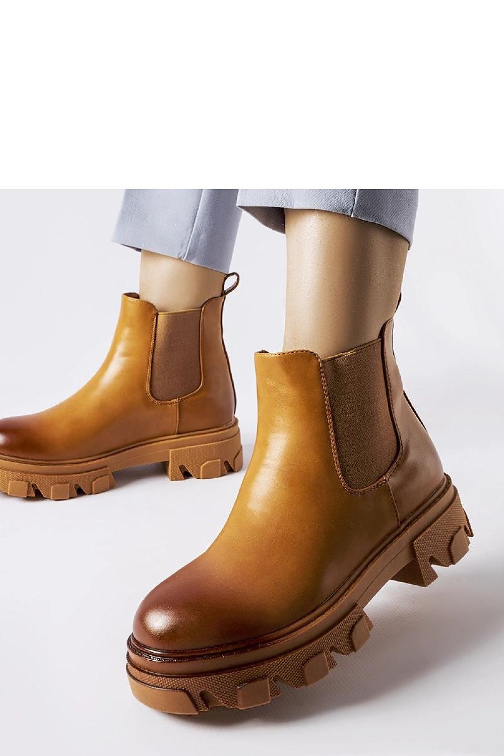 Elegant Solea Brown Slip-On Castell Boots for Women crafted in eco leather with a 5 cm heel, showcasing modern round toe design, perfect for stylish autumn ensembles.