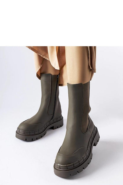 Elegant Solea green rubber boots for women, showcasing stylish comfort and a chic design, perfect for spring and fall outfits.