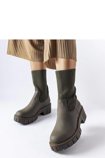 Solea Women's Green Beauchemin Sock Boots showcasing their elegant ankle-length design and slip-on style, perfect for modern fashion enthusiasts.