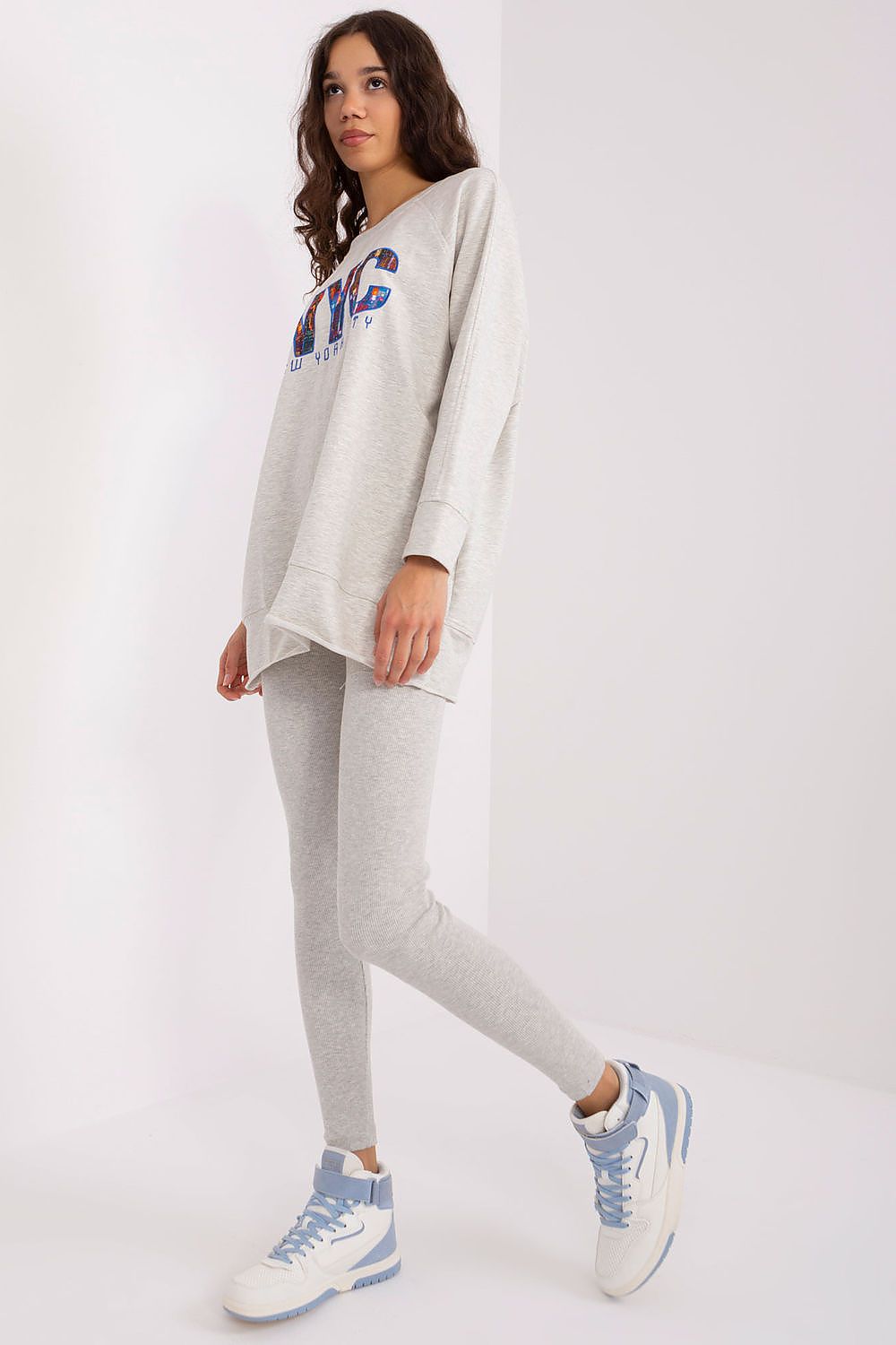 Elegant women's sweatshirt and leggings set by Factory Price, made of high-quality cotton blend for a chic, relaxed look.