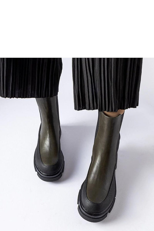 Close-up view of Solea Eco-Friendly Green and Black Faisal Slip-On Boots, featuring chic slip-on closure and high-quality suede leather ideal for fashionable comfort.