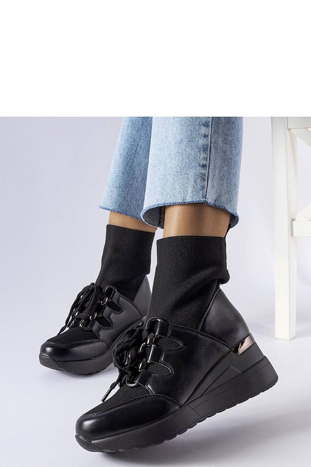 Solea Rochon Black Platform Boots displayed in a versatile setting, ideal for both casual and formal occasions, with a rubber sole for enhanced grip.