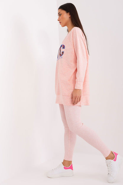 Fashion-forward women's sweatshirt and leggings set by Factory Price, showcasing a unique style and effortless comfort for any occasion.