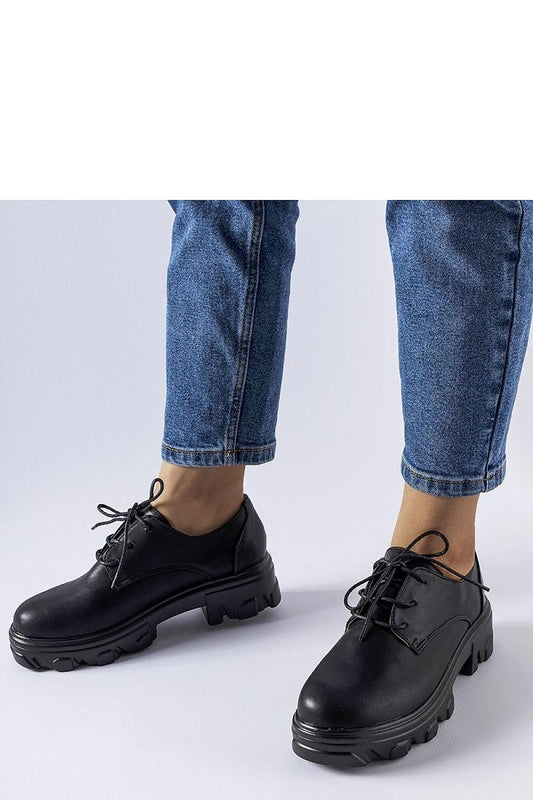 Solea Elegant Black Lacquered Kelly Half Shoes showcasing their eco leather finish and stylish design, ideal for modern women.