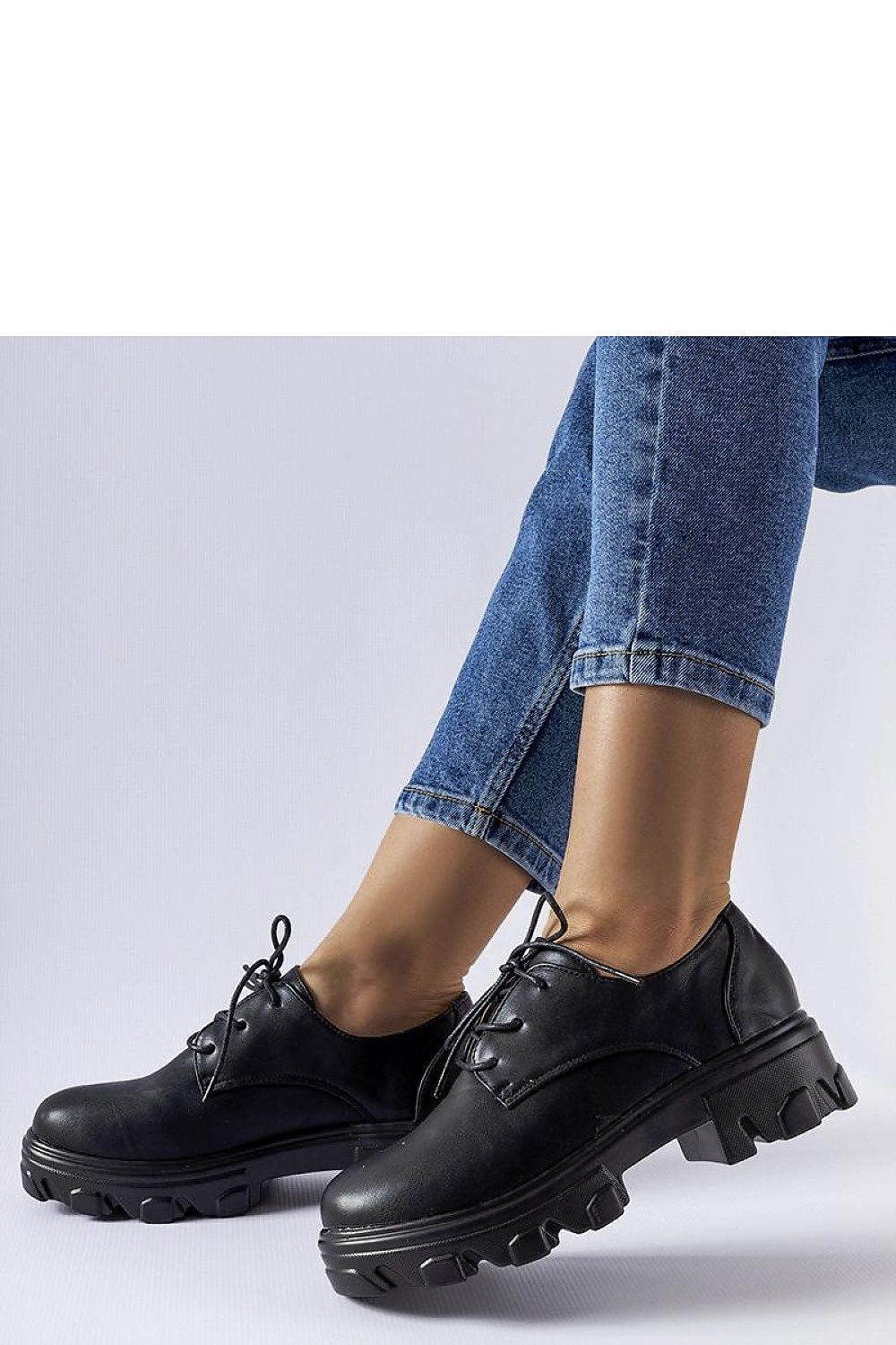 Close-up view of Solea Black Kelly Half Shoes highlighting the lace-up fastening and luxurious eco leather material.