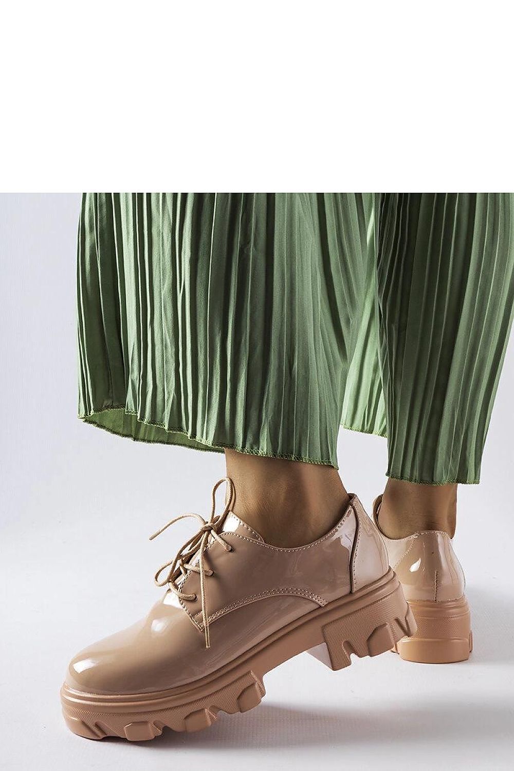 Solea Black Lacquered Kelly Half Shoes displayed on a sophisticated background, emphasizing their versatility for formal and casual wear.