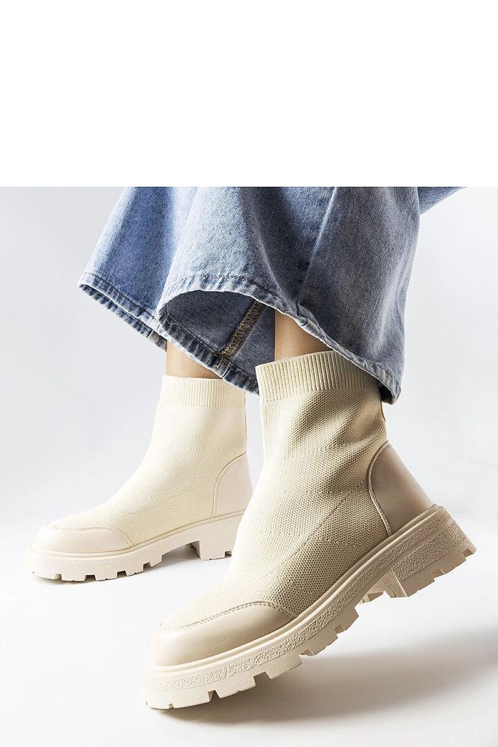 Lonte Beige Sock Boots by Solea worn with a stylish outfit, demonstrating their versatility for both casual and formal occasions.