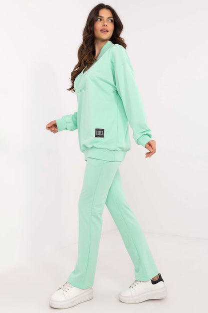 Stylish and comfortable women's fashion set by Factory Price, showcasing a minimalist long-sleeve blouse and high-waist pants ideal for casual outings.
