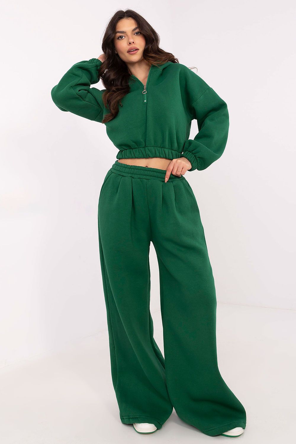 Luxury women's tracksuit set from Factory Price featuring a stylish loose-fit hoodie with a front zipper and wide-leg pants for a comfortable look.