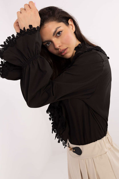 Luxurious Lakerta cotton shirt with long sleeves, lace cuffs, and a stand-up collar, ideal for sophisticated women's fashion.