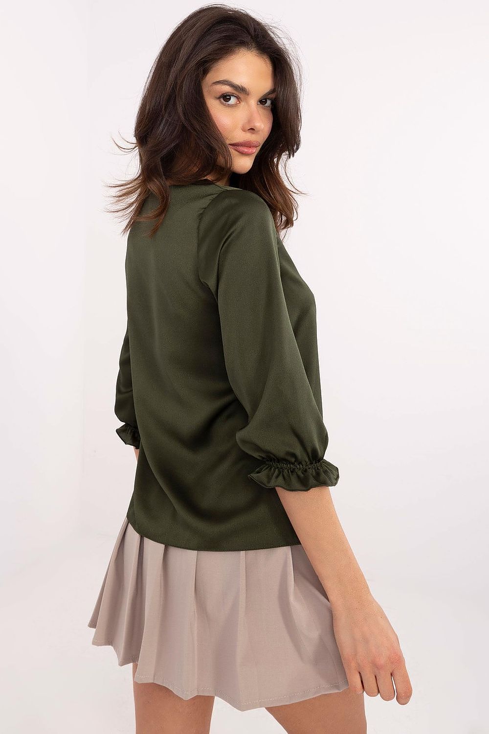 Timeless and chic Lakerta Blouse adorned with subtle ruffles, designed for effortless pairing with elegant trousers and skirts, available in sizes EU 36-42.