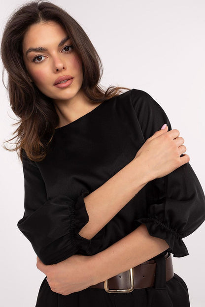 Chic Lakerta blouse with ruffled 3/4 sleeves, crafted from a comfortable viscose-polyester blend.