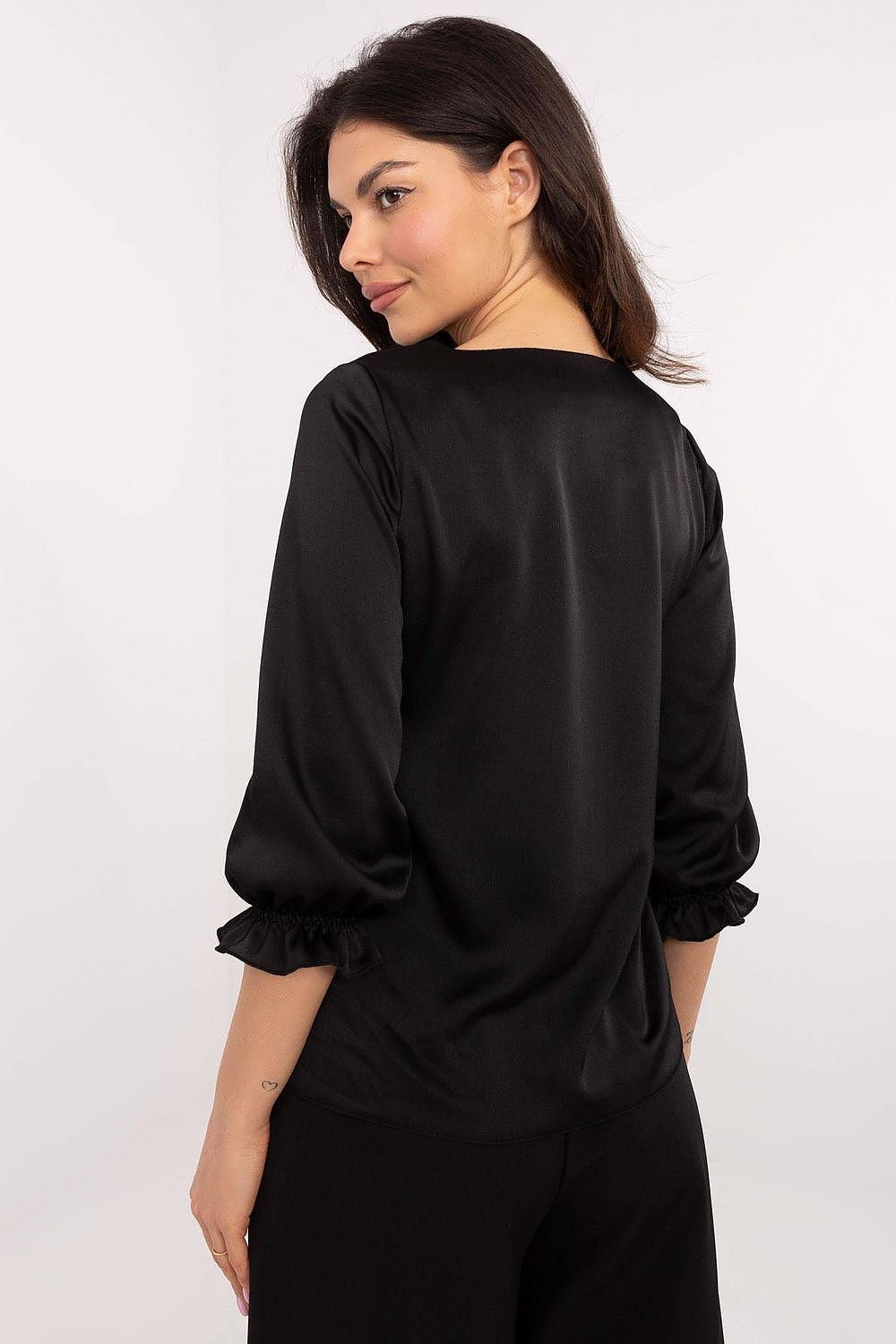 Elegant Lakerta blouse featuring 3/4 sleeves, ruffled details, and stylish minimalist design, perfect for versatile outfits in sizes EU 36-42.