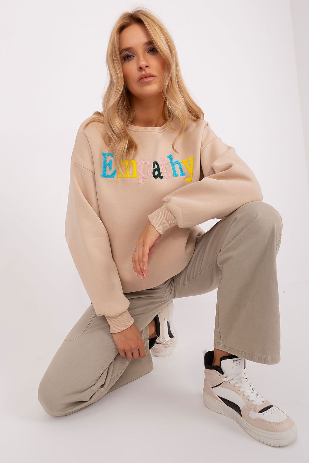 Side view of the women's sweatshirt by Factory Price, showcasing its classic round neckline and long sleeves.
