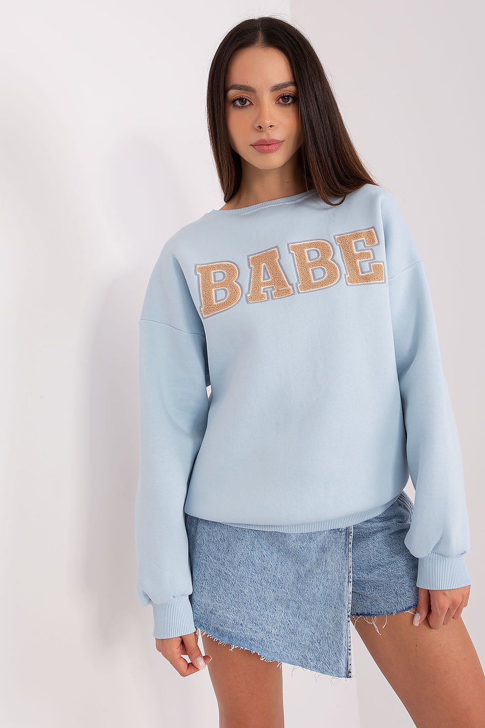 Side angle of a chic women's sweatshirt by Factory Price, featuring a striking pattern that enhances its modern style, ideal for all occasions.