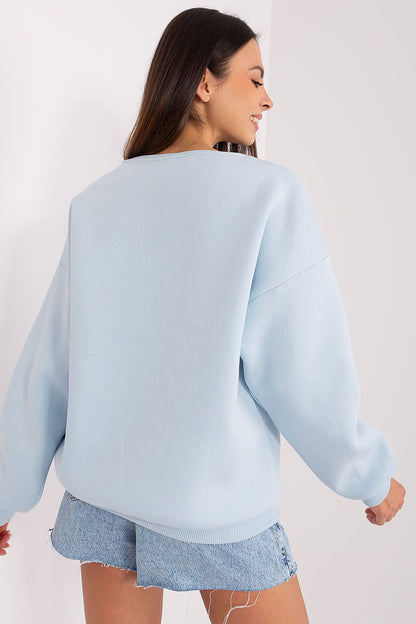 Close-up of the luxurious fabric texture of a women's sweatshirt from Factory Price, showcasing the blend of cotton and polyester for ultimate comfort.
