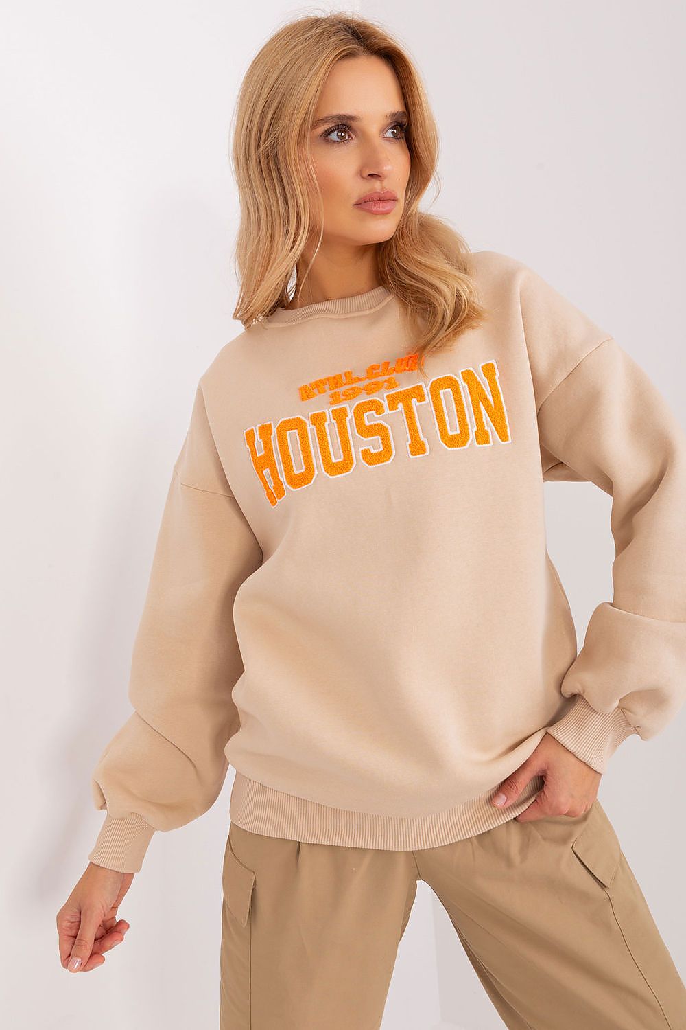 Close-up view of the Luxury Women's Pullover Sweatshirt by Factory Price, highlighting detailed logo and classic round neckline for a timeless, stylish look.