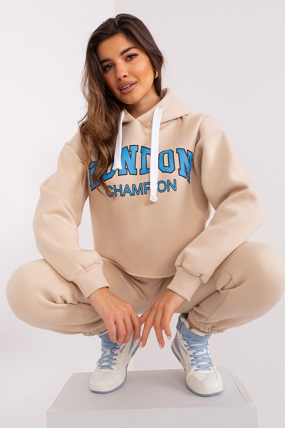 Ex Moda casual tracksuit set showcased in a fashionable urban setting, embodying contemporary luxury and effortless style.