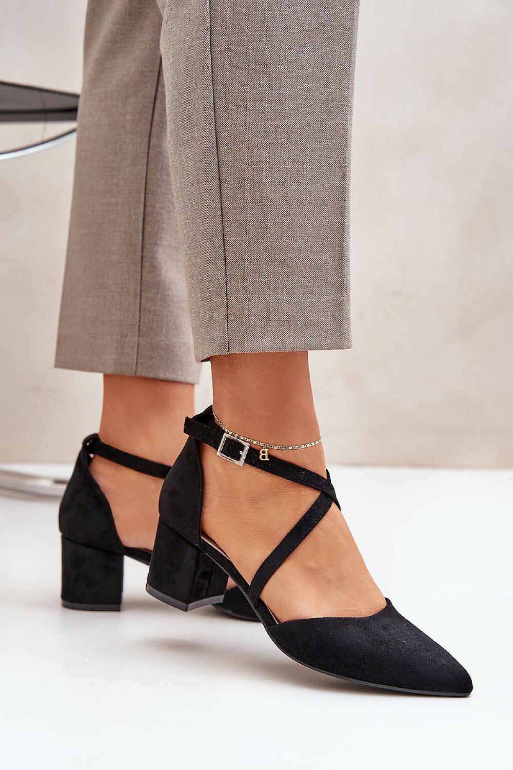 Close-up of Step In Style Women's Block Heel Pumps, showcasing the luxurious eco leather and the intricate design of interwoven straps on an elegant pointed toe silhouette.