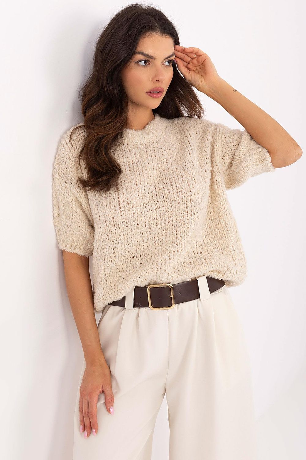 Luxurious women's short sleeve sweater by Italy Moda, crafted from an elegant acrylic-wool blend, showcased in a stylish setting.