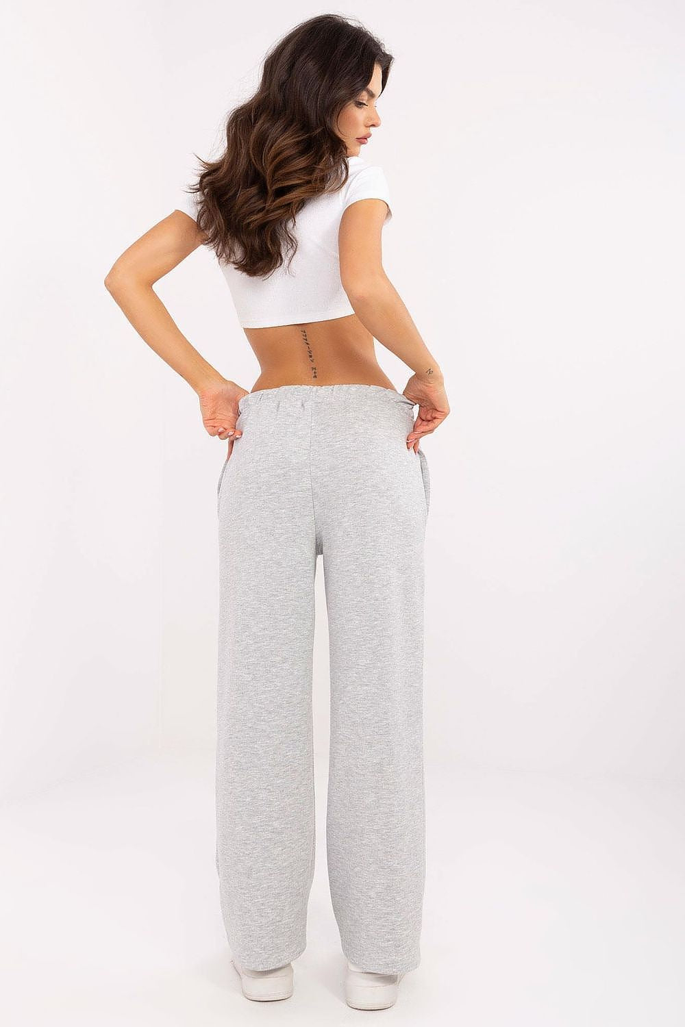 Italy Moda Women's High-Waist Tracksuit Trousers presented with straight legs and stylish cuffs, ideal for adding a touch of luxury to everyday wear.