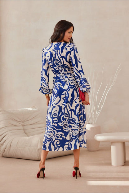 Roco Fashion luxurious midi dress featuring long sleeves, a stylish wrap top and a flared skirt, perfect for elegant occasions.