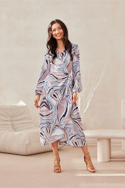 Beautiful detail of Roco Fashion's midi dress showcasing the fine fabric and double tie waist design for a chic silhouette.