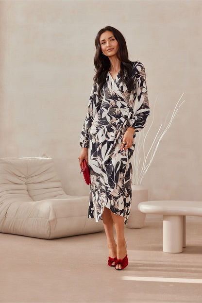 Roco Fashion's exquisite midi dress displayed in a stunning environment, ideal for fashion-forward women seeking elegance.