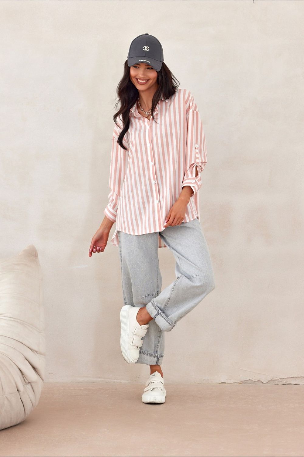 Close-up detail of Roco Fashion's oversized long sleeve shirt cuffs adorned with decorative buttons, capturing the exquisite craftsmanship and stylish design.