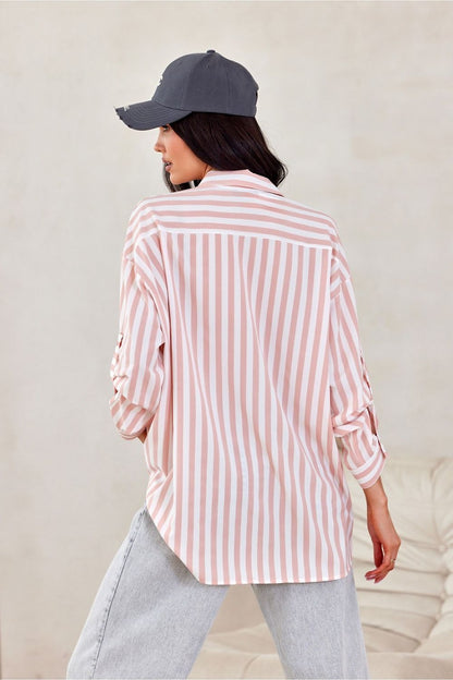 Stylish Roco Fashion oversized long sleeve shirt displayed on a mannequin, highlighting its striking asymmetrical cut and elegant silhouette.