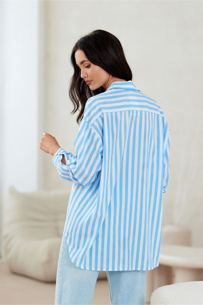 Elegant asymmetrical cut oversized shirt from Roco Fashion with stylish buttoned cuffs, perfect for chic casual wear in EU sizes S/M to L/XL.