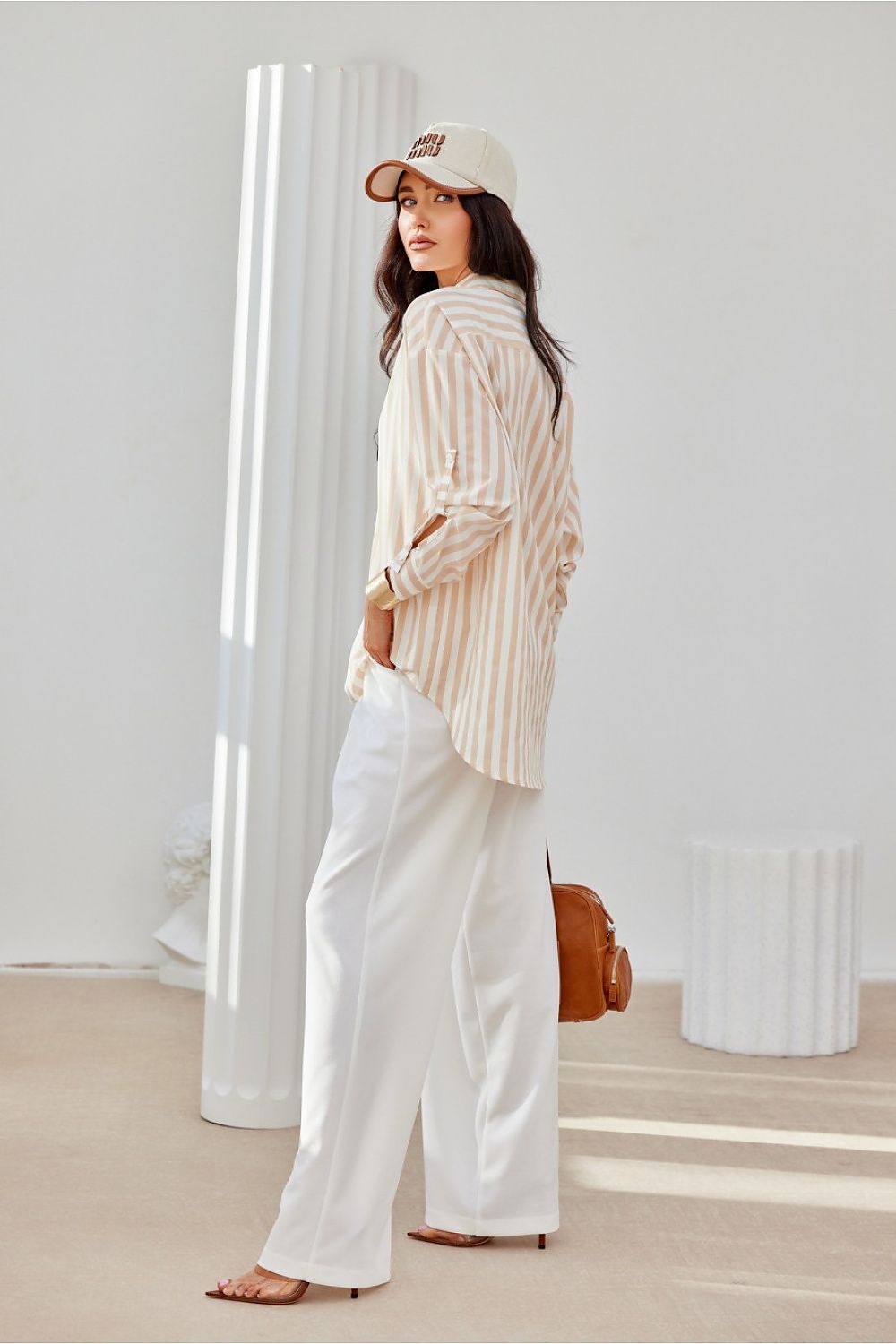 Roco Fashion oversized shirt flat lay, illustrating its fashionable long sleeves and distinctive decorative cuffs, designed for comfort and elegance in EU sizes S/M to L/XL.