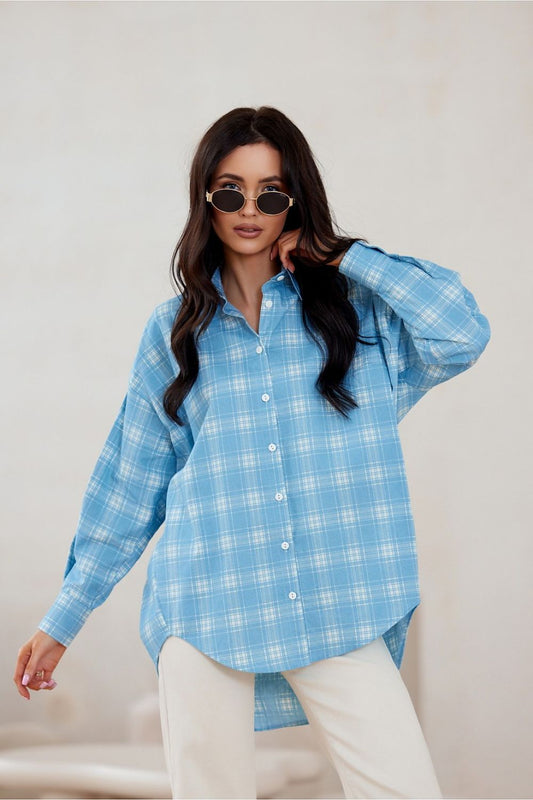 Roco Fashion oversized long sleeve shirt featuring asymmetrical cut and decorative buttoned cuffs in luxurious cotton fabric.