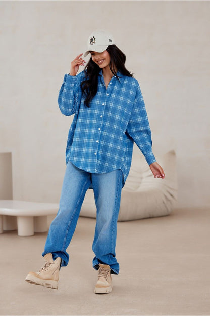 Roco Fashion oversized long sleeve shirt in luxurious cotton with asymmetrical cut and decorative buttoned cuffs.
