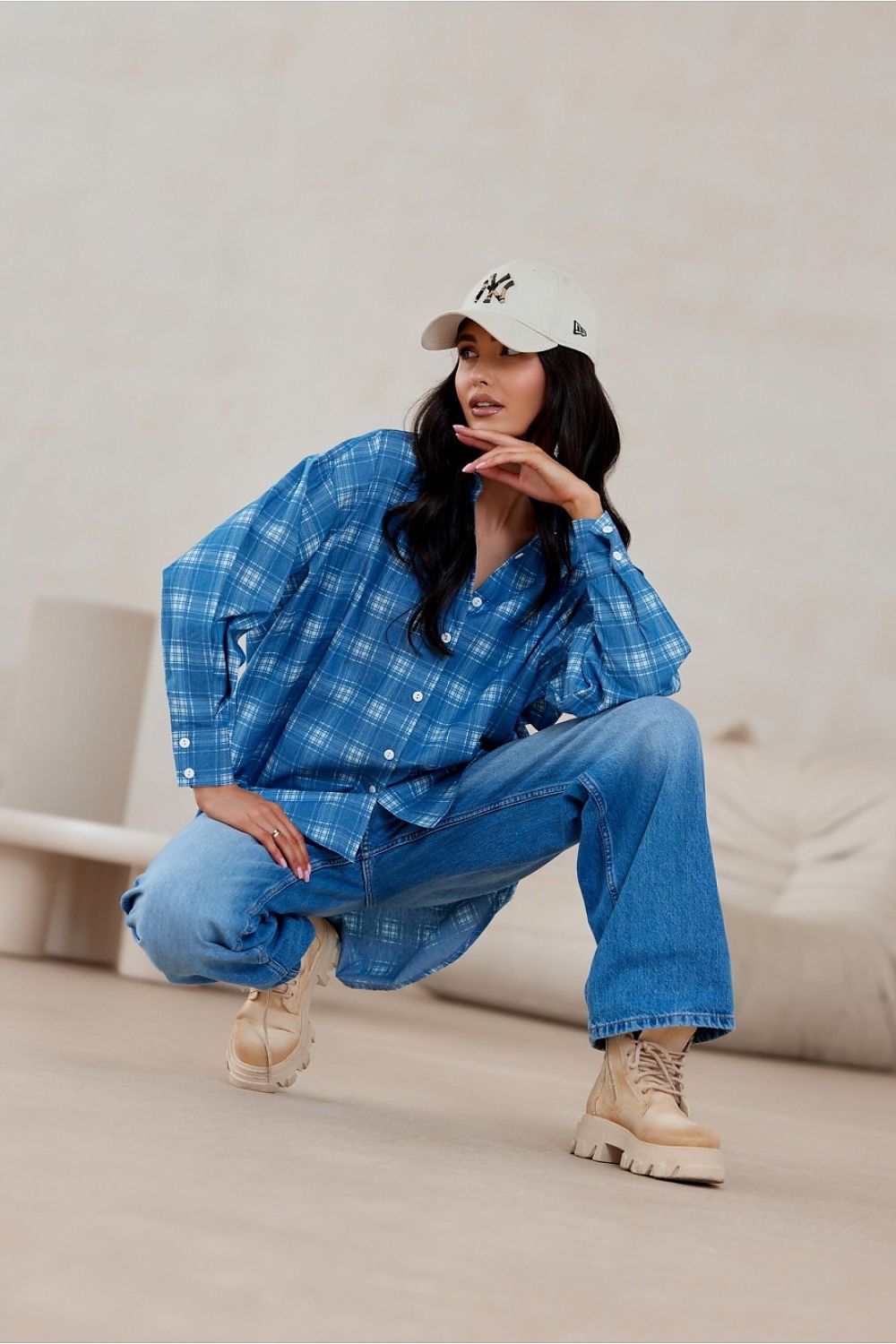 Elegant Roco Fashion oversized shirt showcasing an asymmetrical design and stylish buttoned cuffs, ideal for a chic wardrobe.