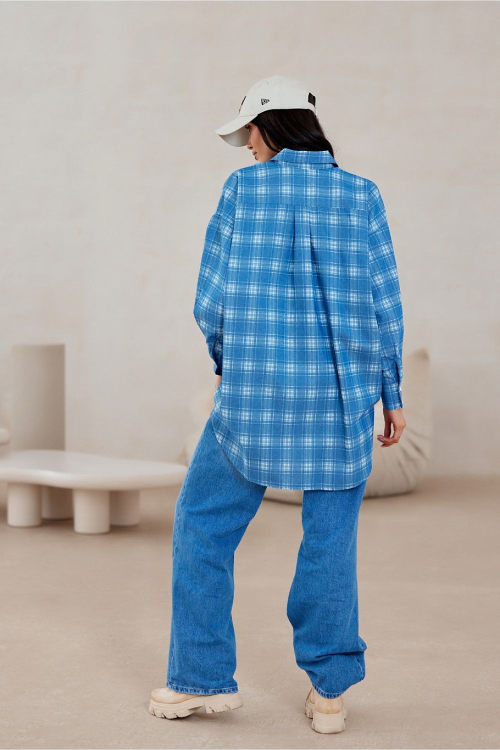 Roco Fashion long sleeve oversized shirt featuring exquisite button detailing and a contemporary asymmetrical cut.