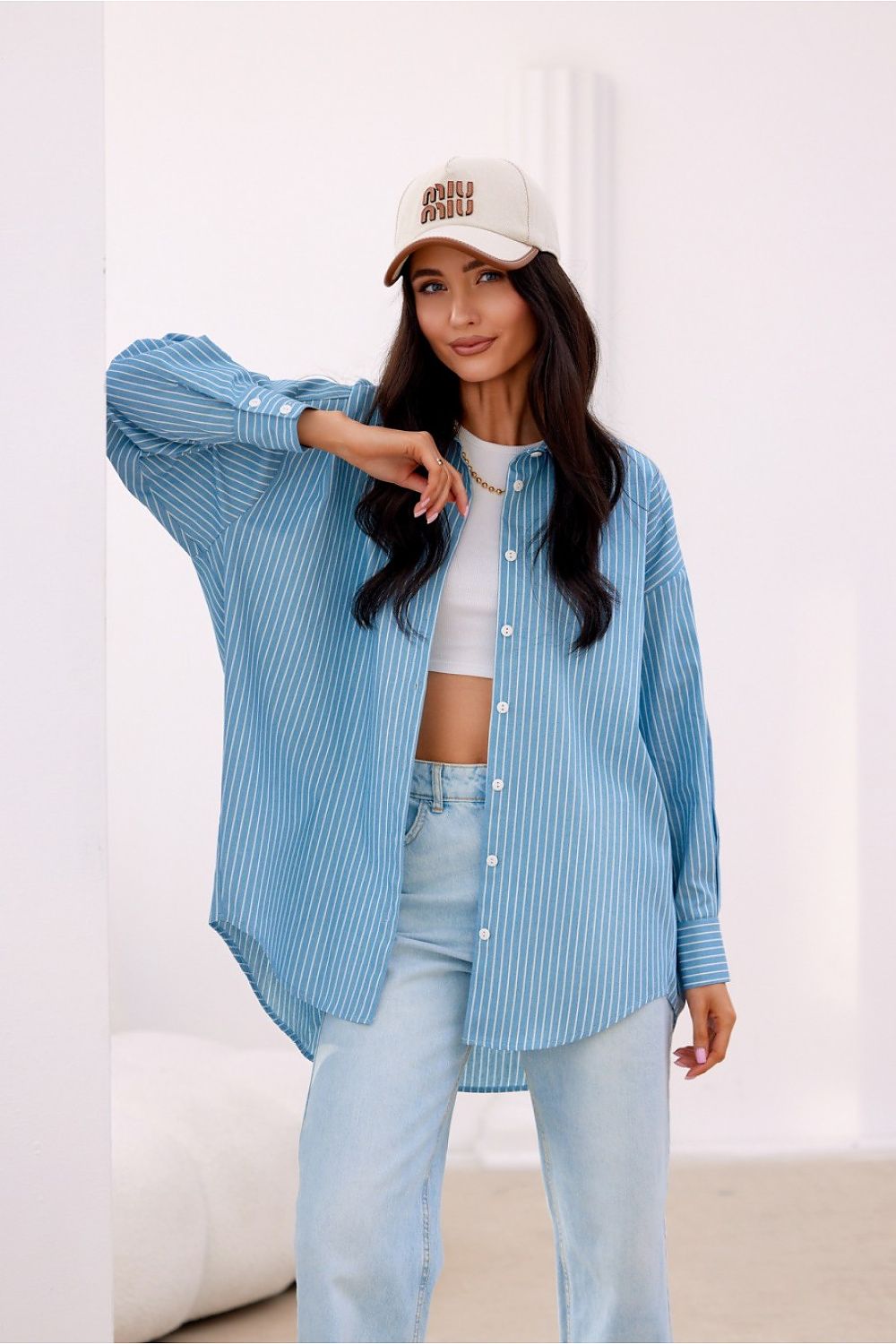 Elegant styling of Roco Fashion's oversized shirt, highlighting the unique button-down front and premium cotton texture.