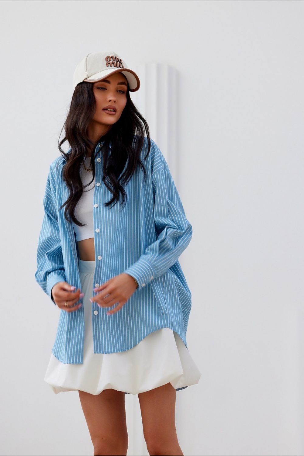 Roco Fashion oversized long sleeve shirt with asymmetrical cut showcasing decorative buttoned cuffs in luxurious cotton fabric, available in sizes S/M and L/XL.