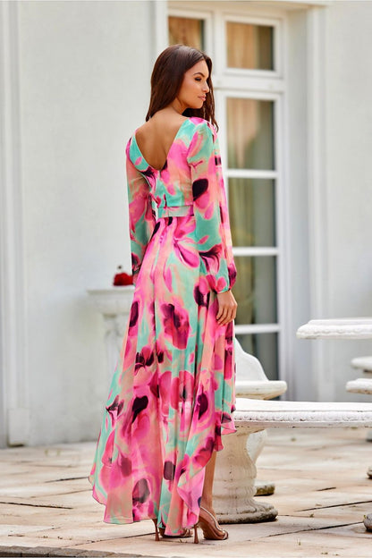 The stunning silhouette of Roco Fashion's asymmetric maxi dress, featuring a fitted waist and flared skirt, ideal for enhancing any figure.