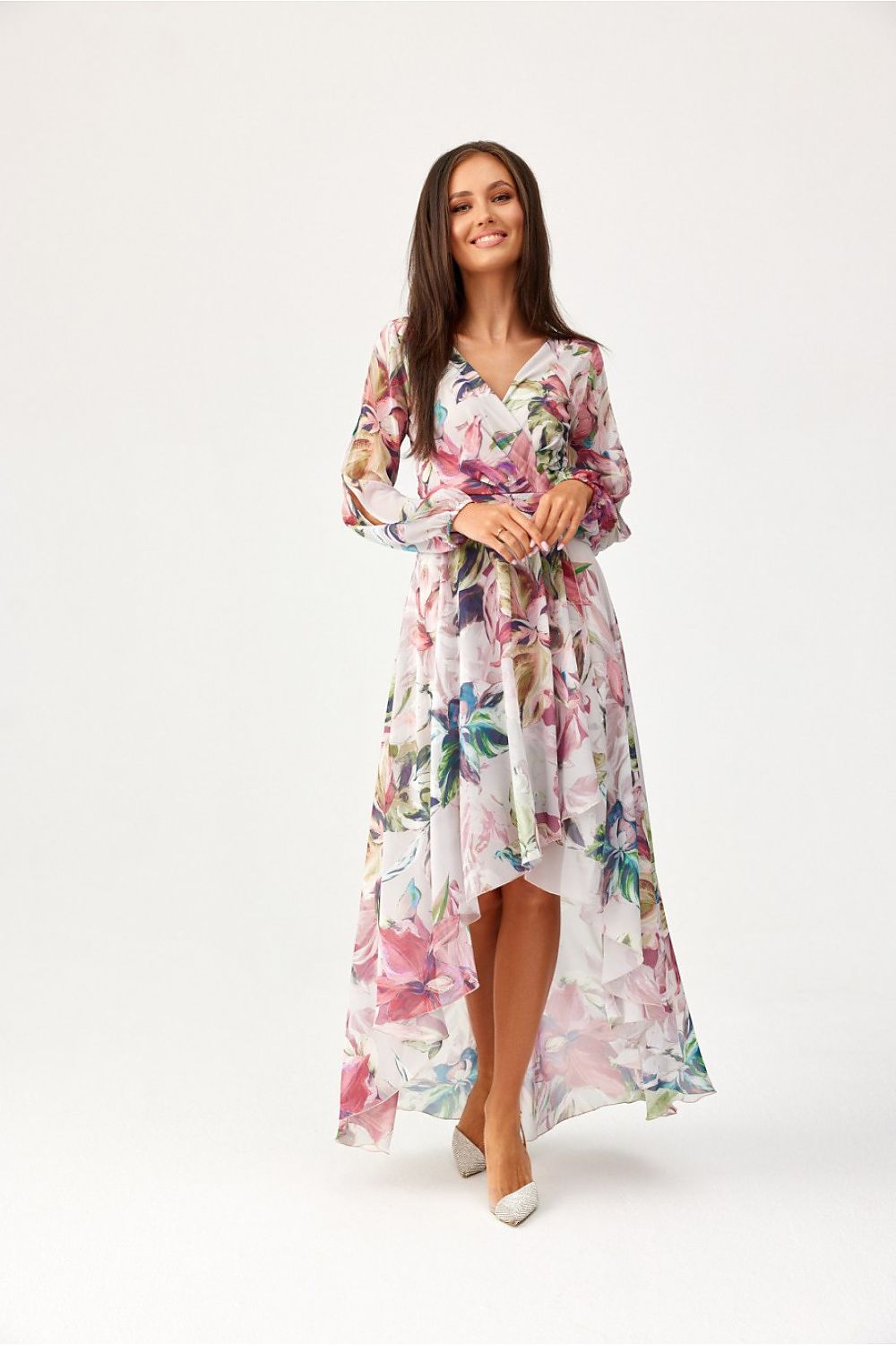 Roco Fashion model showcasing the stunning Asymmetric Maxi Dress with decorative slits and flowing material in a luxurious setting.