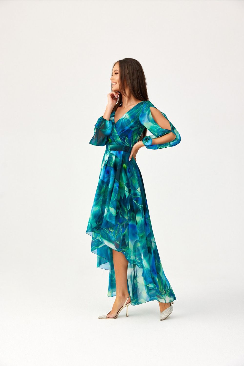 The flared bottom of the Roco Fashion asymmetric maxi dress showcasing its flowing and delicate material, ideal for special occasions.