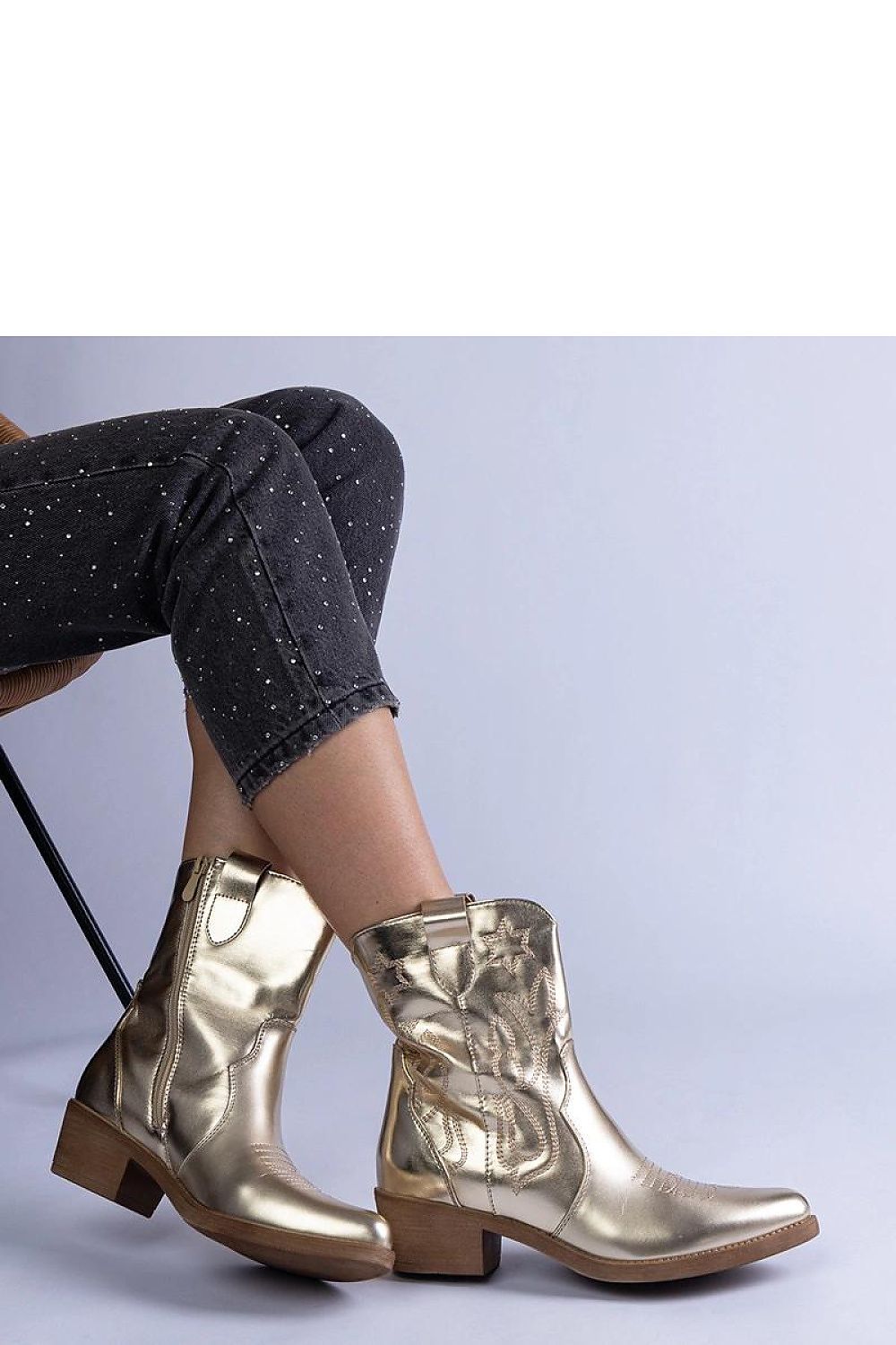 Solea Golden Cowboy Ankle Boots in metallic vegan leather, showcasing elegant design and stylish comfort, perfect for chic winter outfits.