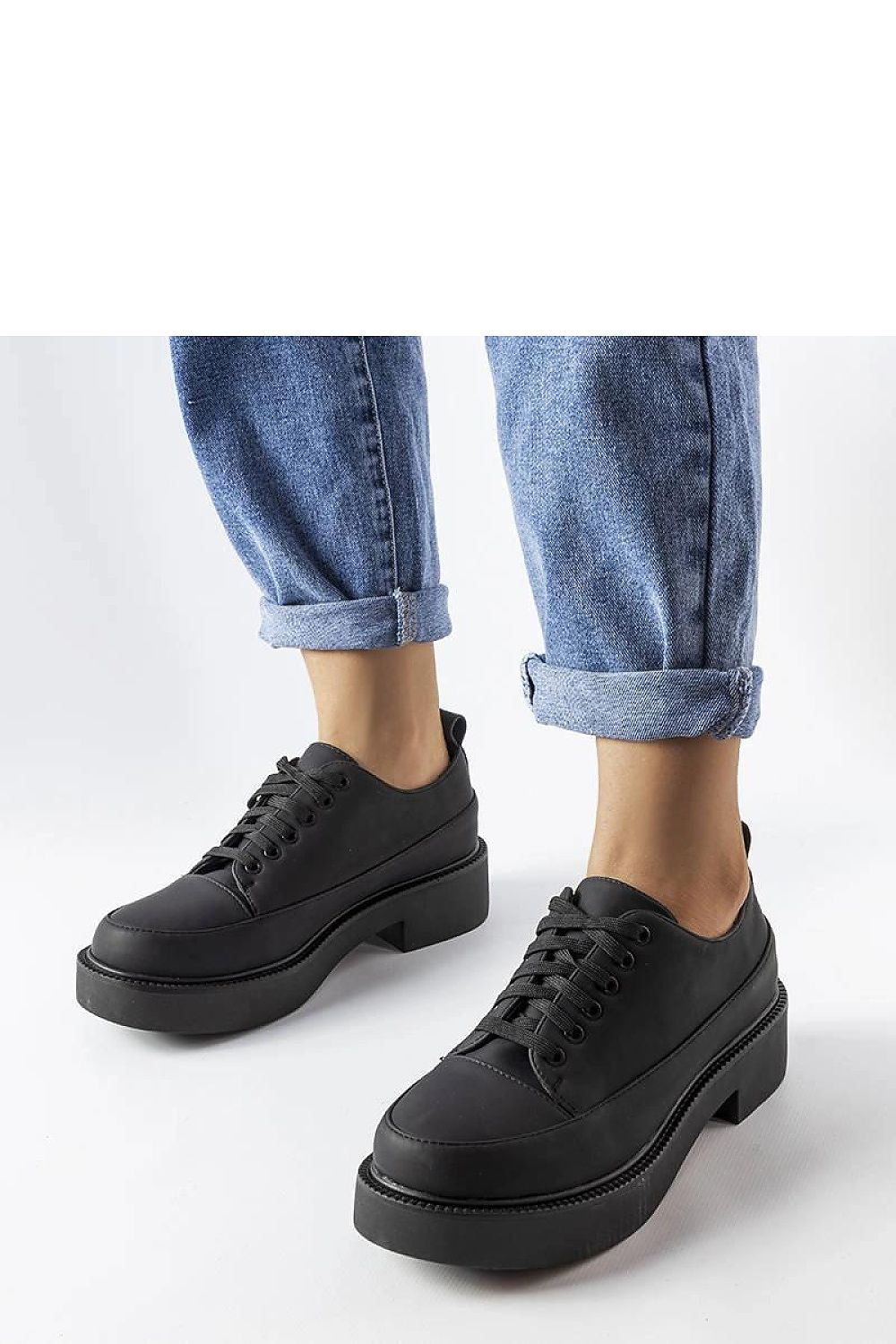 Solea luxury elegant black eco-leather flat-heeled summer shoes displayed naturally, showcasing their refined design and perfect fit for warm days.