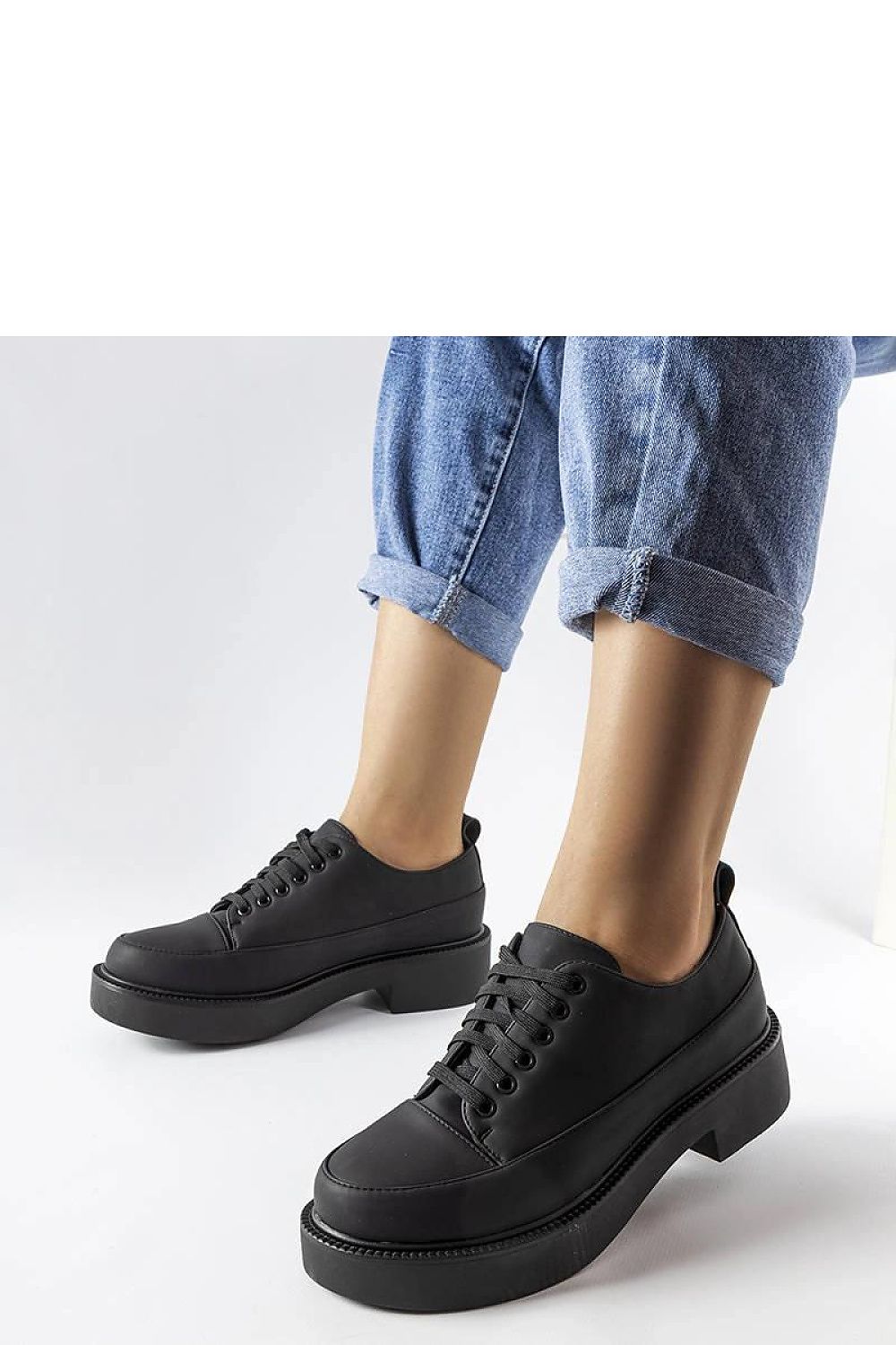 Close-up of Solea elegant black flat-heeled summer shoes in eco leather, highlighting the craftsmanship and sophistication ideal for stylish summer ensembles.