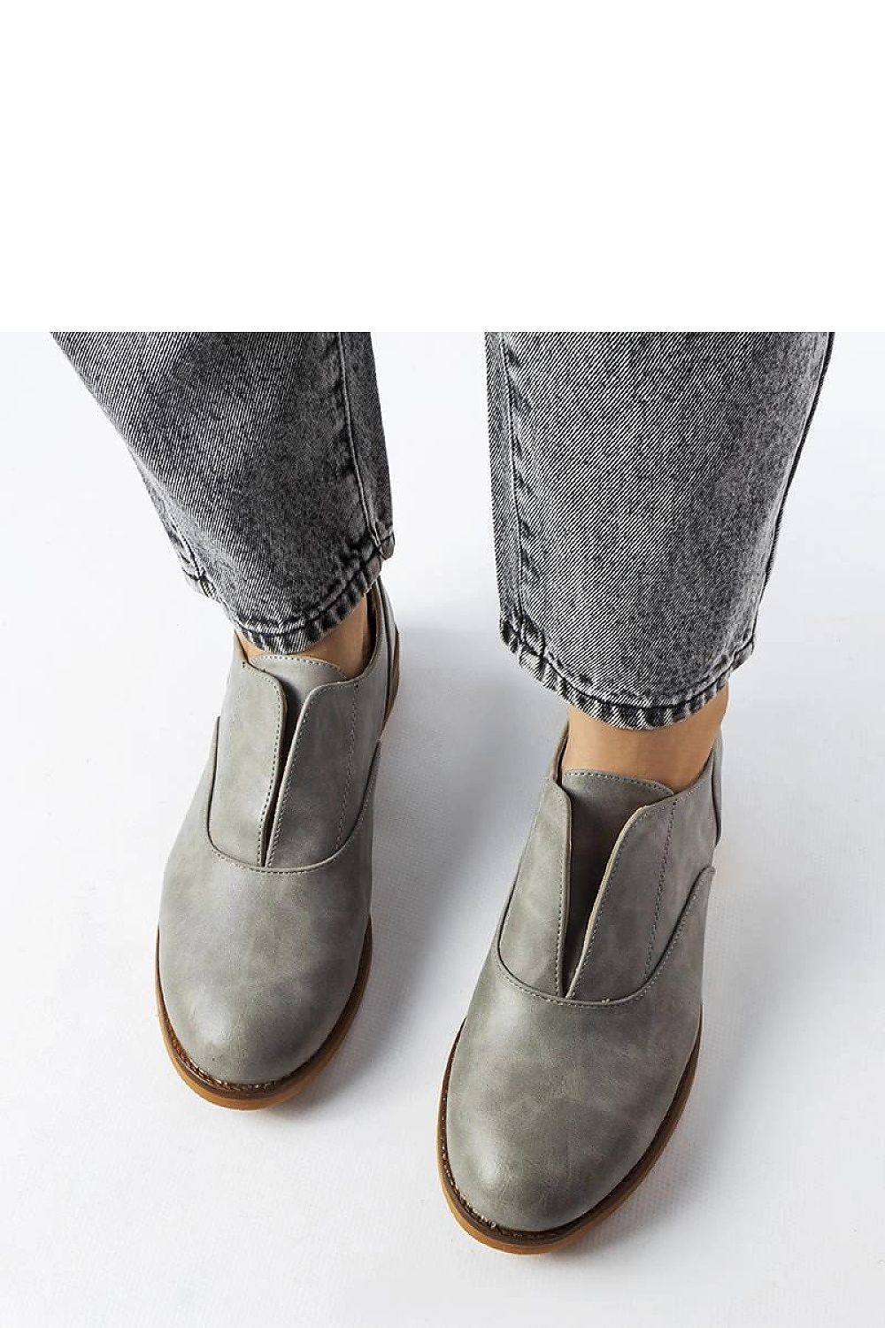 Lifestyle image of Solea red Burdett loafers paired with casual attire, embodying eco-friendly luxury.