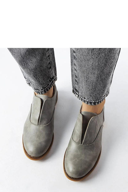 Lifestyle image of Solea red Burdett loafers paired with casual attire, embodying eco-friendly luxury.