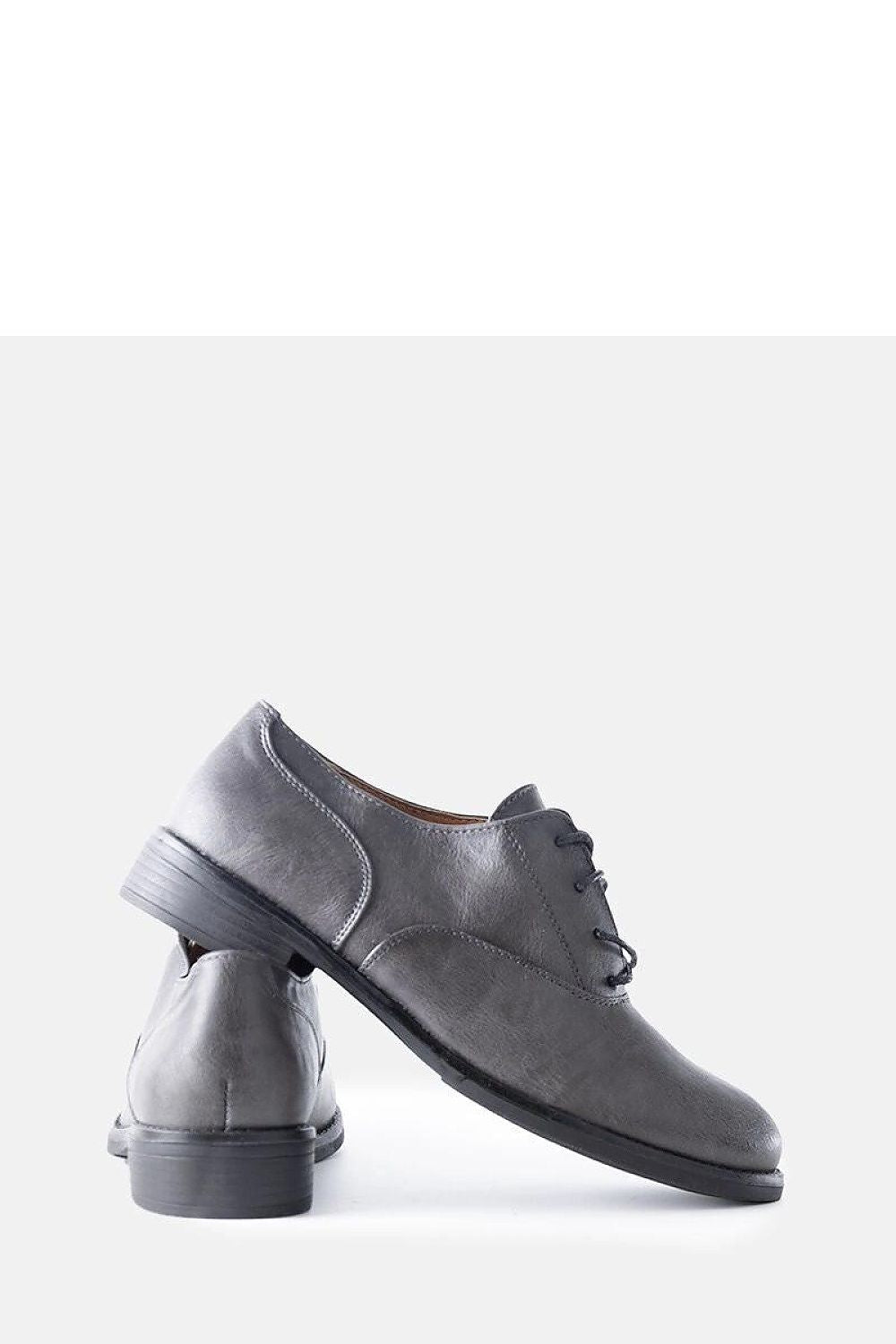 Solea Red Burdett vegan leather loafers in a serene outdoor setting, demonstrating their ideal wearability and comfort for all-day use.