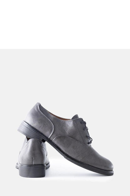 Solea Red Burdett vegan leather loafers in a serene outdoor setting, demonstrating their ideal wearability and comfort for all-day use.