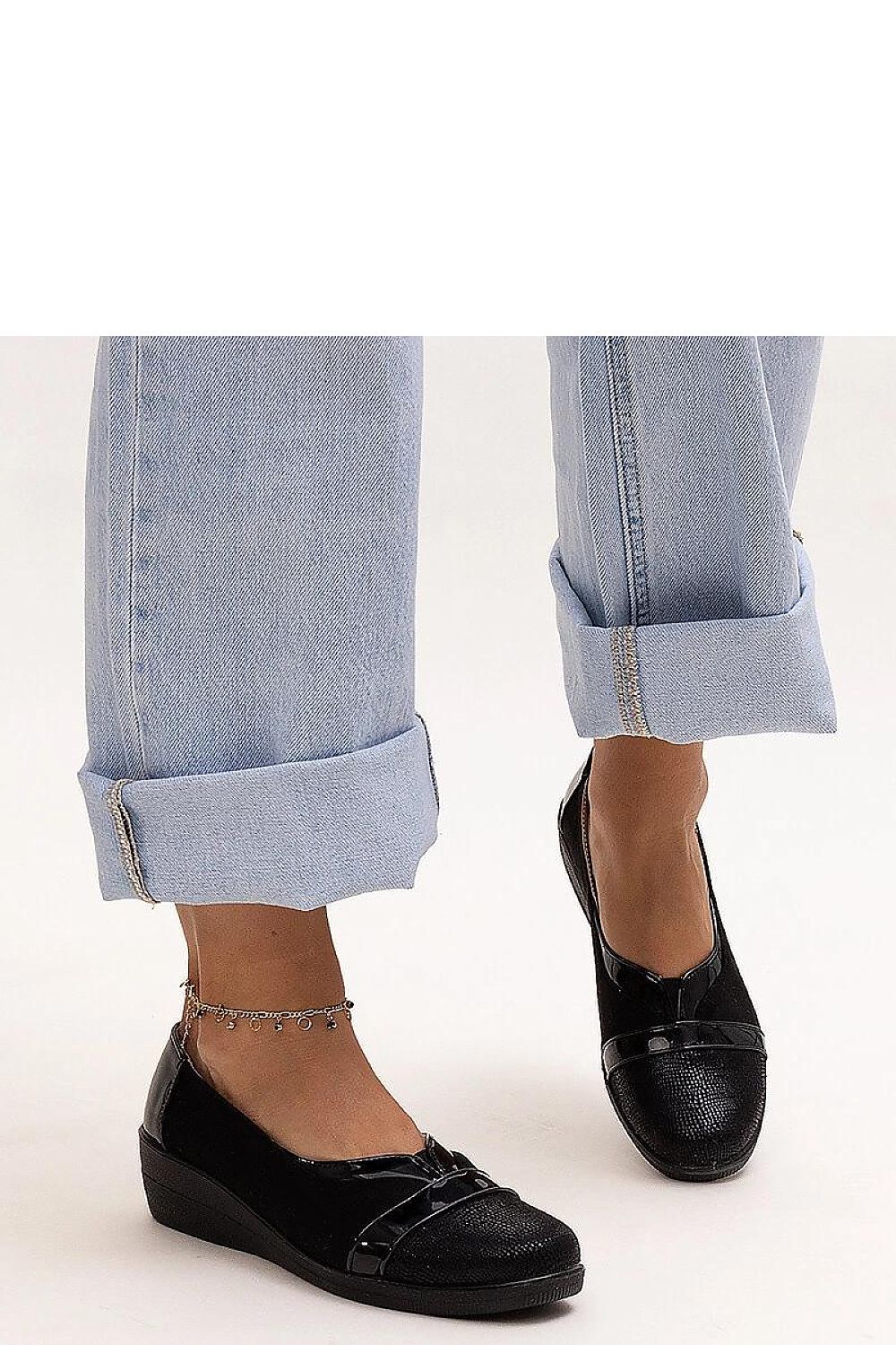 Elegant Solea Black Wedge Half Shoes showcasing stylish design perfect for summer, featuring a comfortable 5 cm heel.